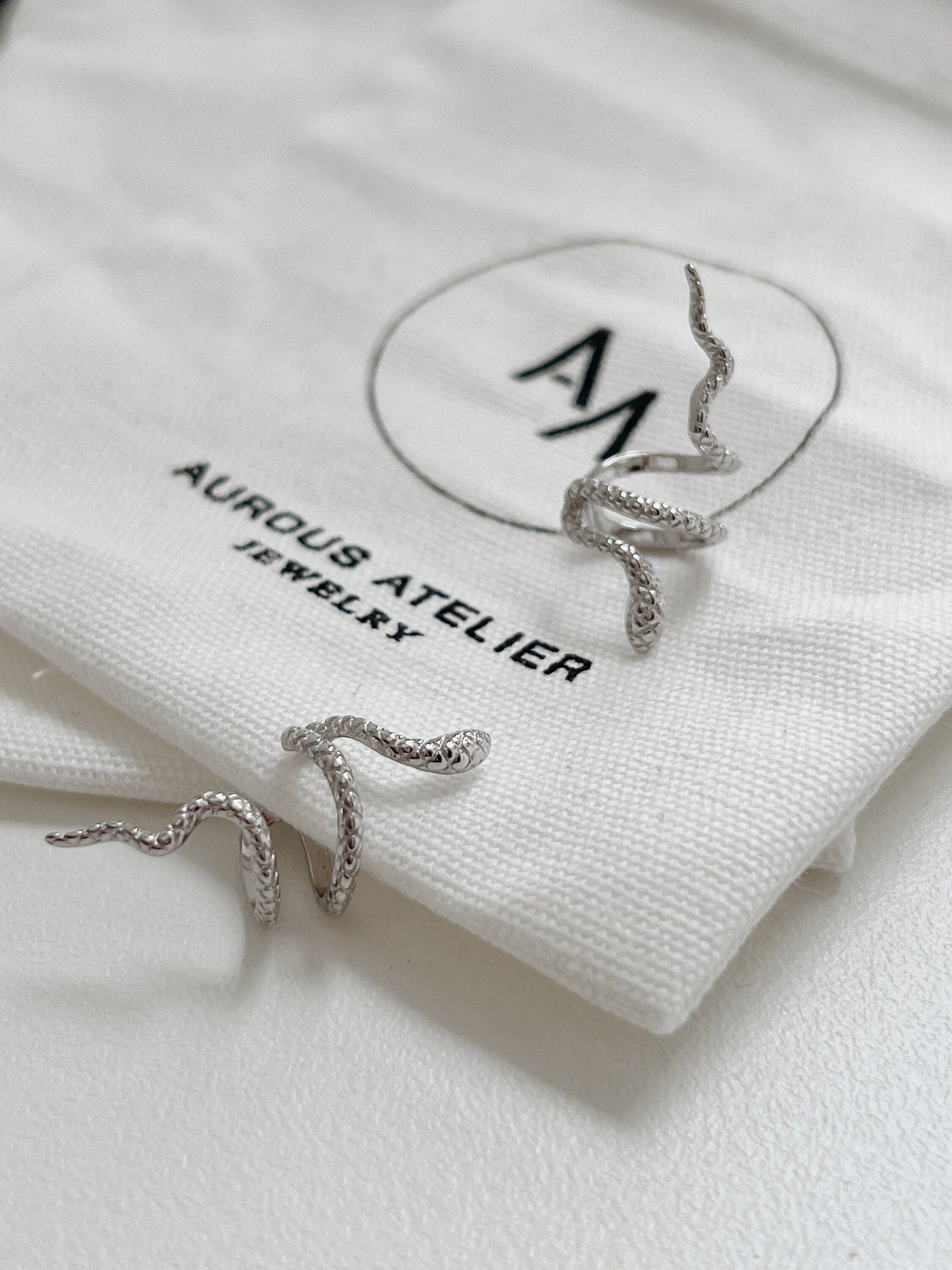 Top-down view of Victoria sculptural silver ear cuff.