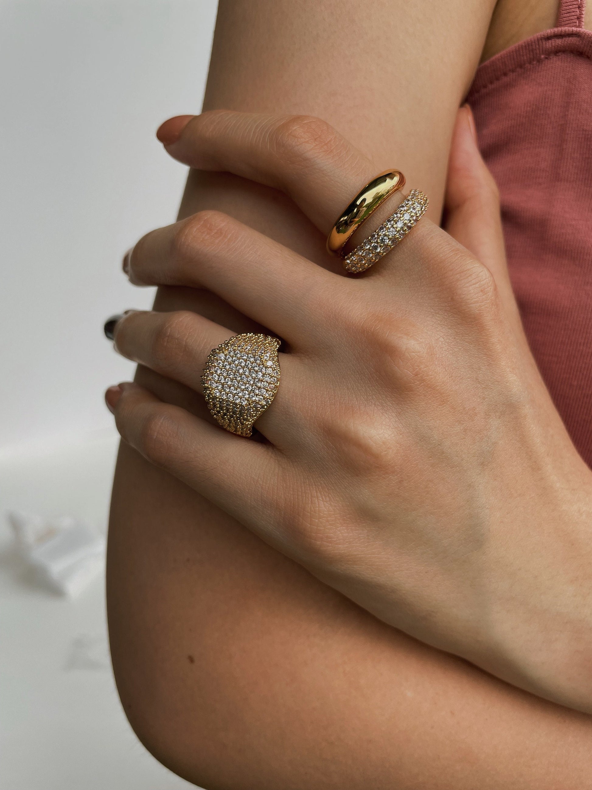 Modern muse hand stack featuring weighted gold pave jewellery