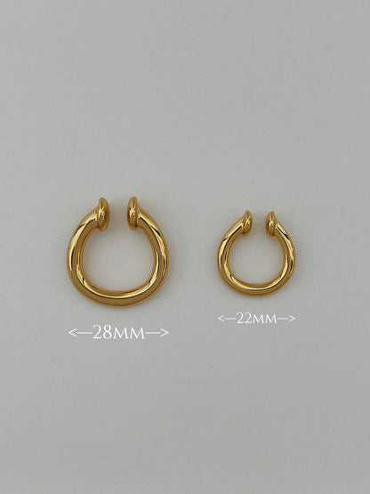 The size comparison of brooklyn non-pierced statement hoop earring in polished 18K gold.