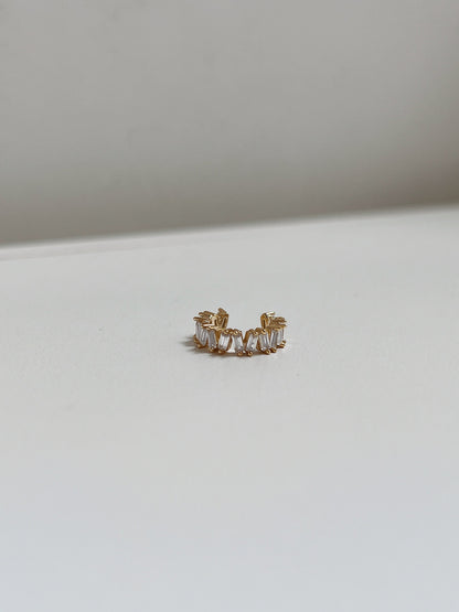Front view of geometric gold baguette ear cuff.