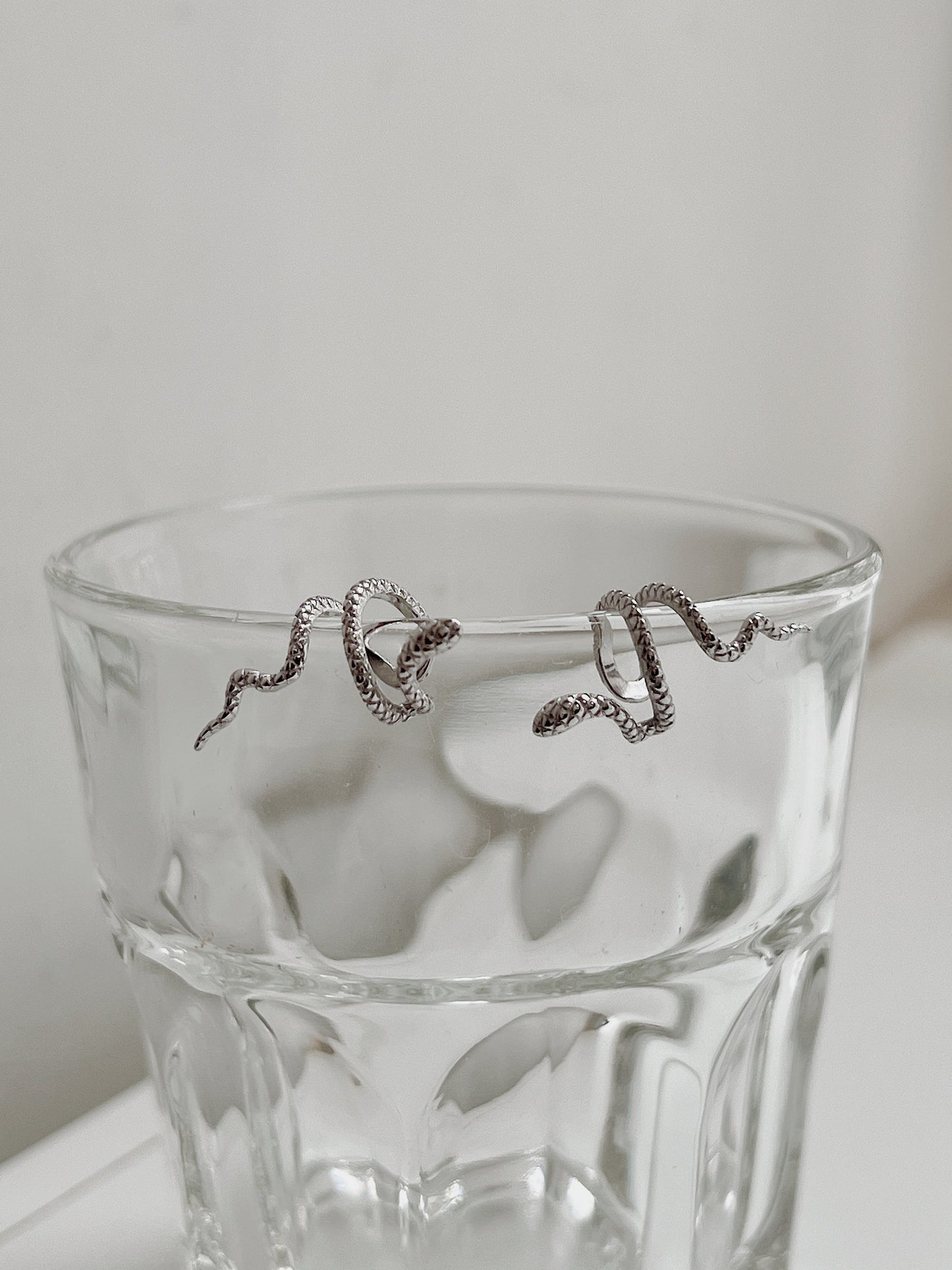 Front view of Victoria silver serpent cuff natural lighting