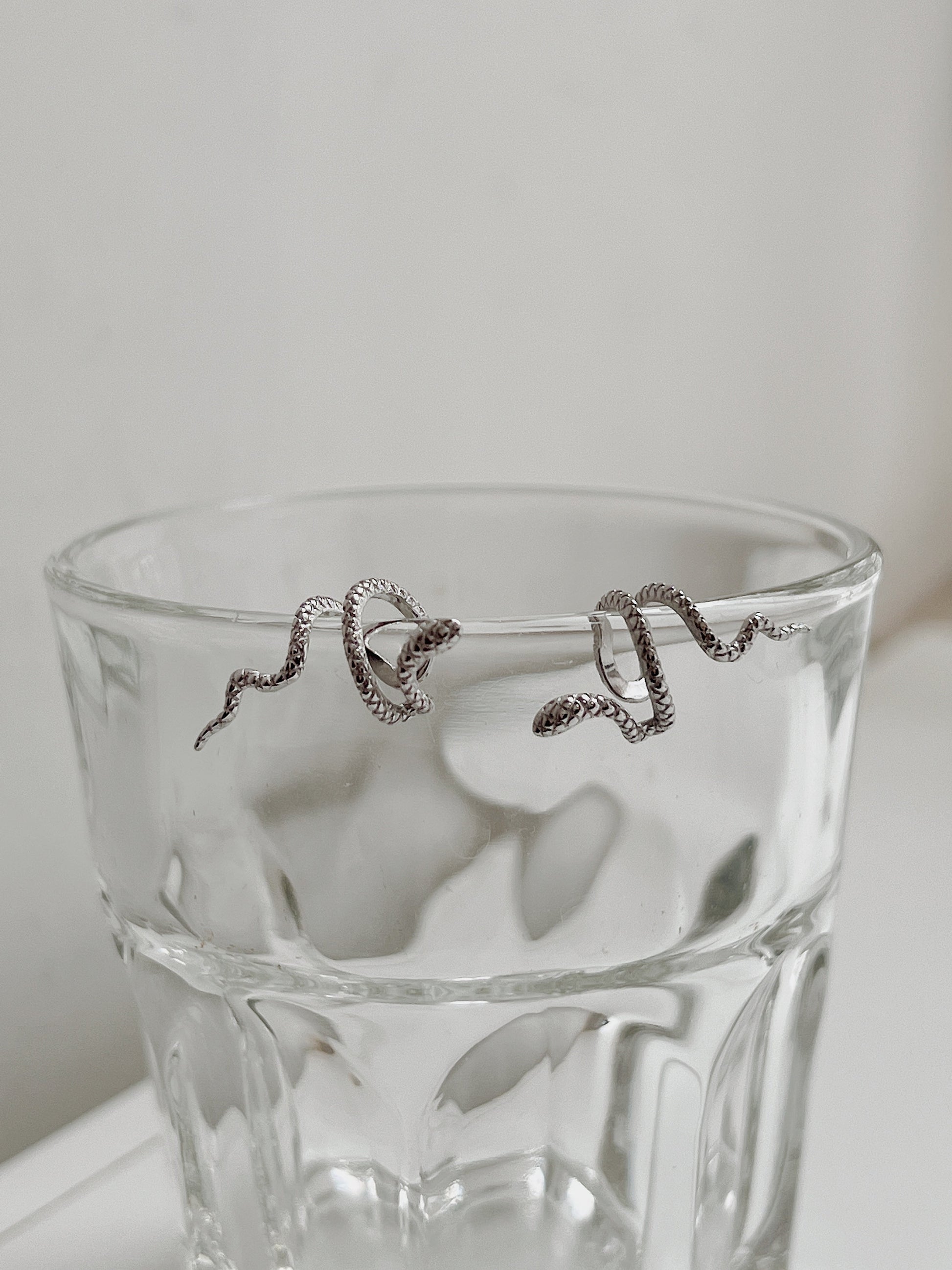 Front view of Victoria silver serpent cuff natural lighting