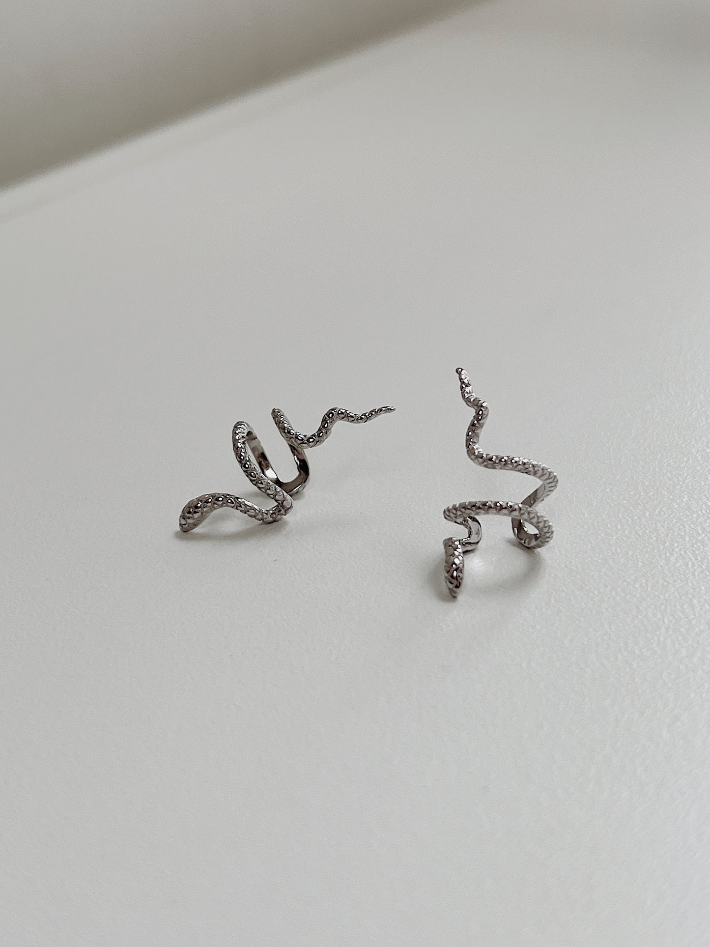 Minimalist architectural band design of Victoria silver cuff.