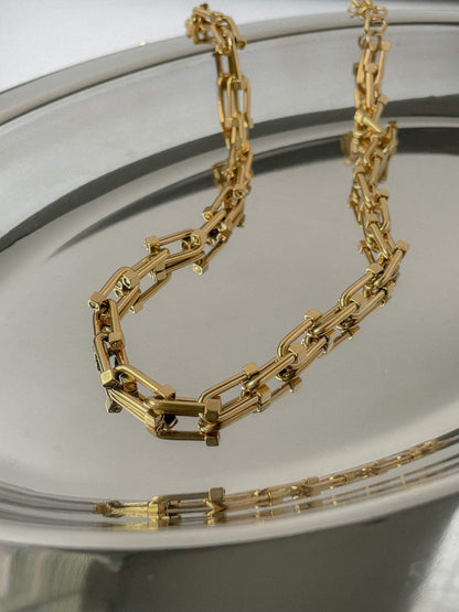 Close up of premium gold vacuum plated industrial gauge hardware link texture