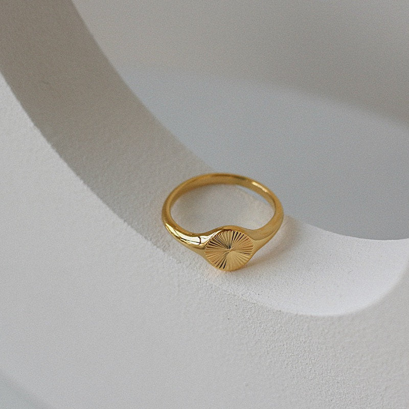 Waterproof gold celestial signet ring by Aurous Atelier
