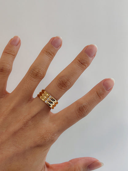 Hand model wearing Blake wide ribbed ring on the middle finger